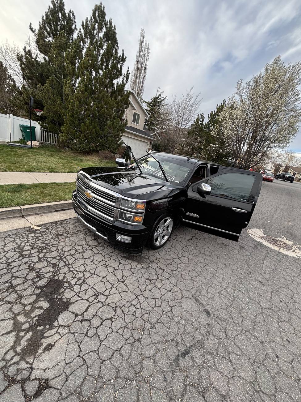 Black Cadillac Escalade parked after a full exterior detail